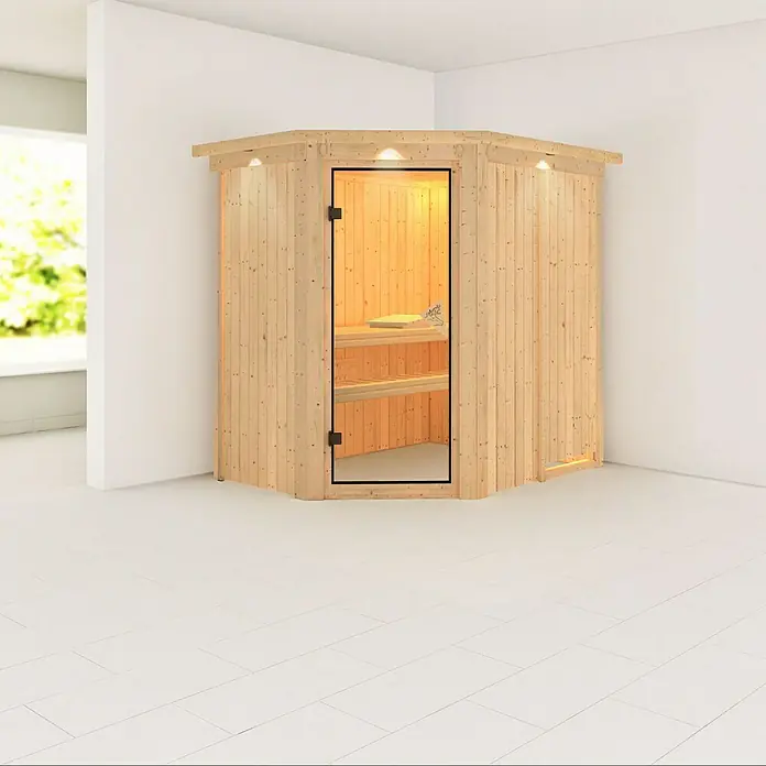 Karibu Massivholzsauna Saja - Ohne Ofen, Mit Dachkranz und Beleuchtung, L x B x H: 165 x 210 x 192 cm - Abbildung einer hellen, hölzernen Ecksauna mit Glastür in einem hellen Raum.