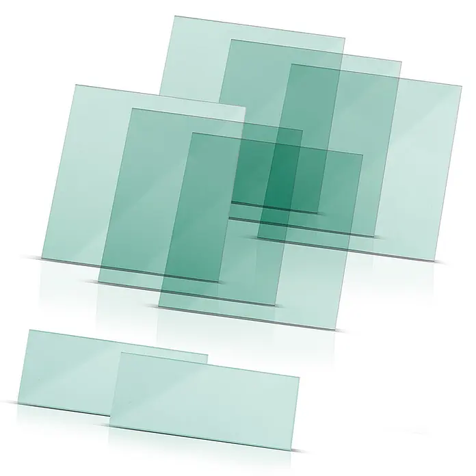 STAHLWERK Schutzhelm Schweißhelm Ersatzscheiben ST 550 L 8er Set -  - Gestapelte, überlappende rechteckige Platten aus durchscheinendem grünen Glas, die Transparenz zeigen.