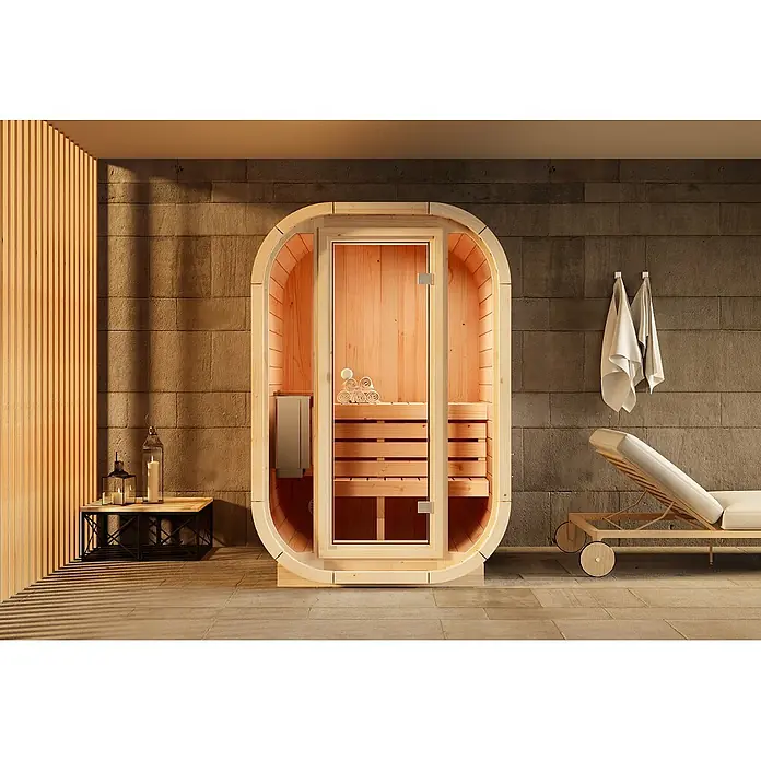 FinnTherm Massivholzsauna Ellipso S -  - Ovalförmige Sauna aus hellem Holz mit Glastür in modernem Spa-Ambiente.
