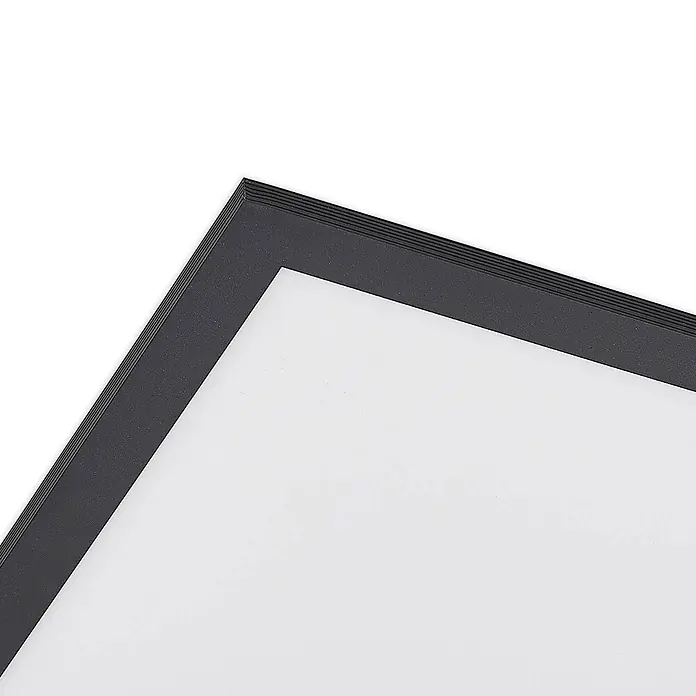 Lindby LED-Panel Nelios - schwarz, Neutralweiß - Ecke eines strukturierten schwarzen Rahmens mit sichtbaren Schichten, der eine weiße Fläche umschließt.