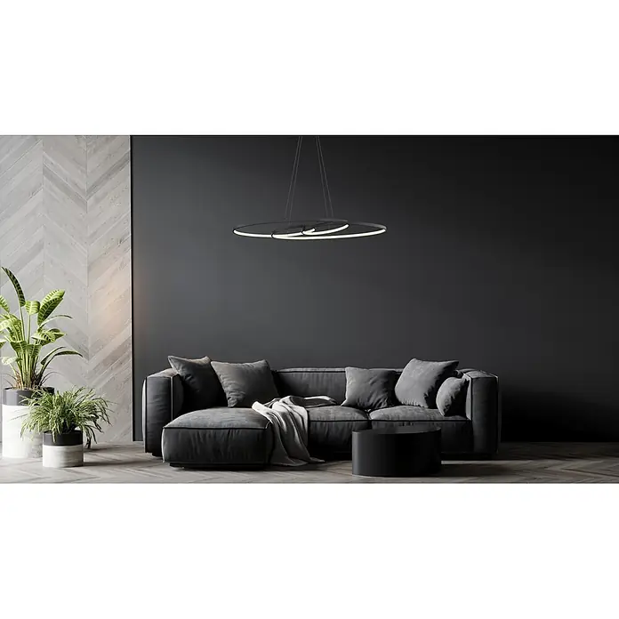 Globo LED-Pendelleuchte rund Spira - 39 W, Warmweiß - Modernes dunkelgraues Ecksofa mit Kissen und Decke in einem zeitgenössischen Wohnzimmer.