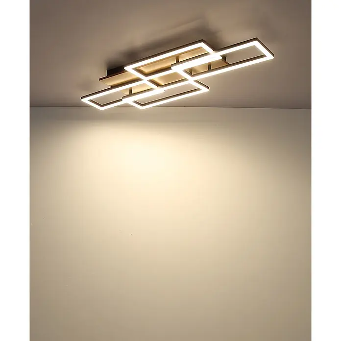 Globo LED-Deckenleuchte Jeffry - 40 W, L x B x H: 875 x 325 x 75 mm - Moderne rechteckige LED-Deckenleuchte mit weißen Leuchtelementen und bronzefarbenem Sockel, die warmes Licht an eine Wand wirft.