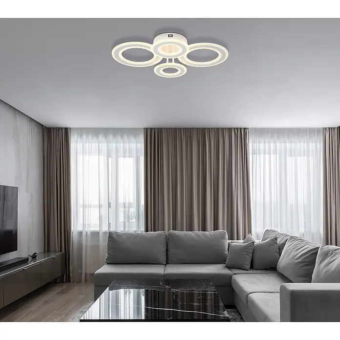 Globo LED-Deckenleuchte Anthony - 54 W, L x B x H: 590 x 420 x 120 mm - Moderne weiße LED-Deckenleuchte mit ineinandergreifenden Ringen in einem Wohnzimmer.