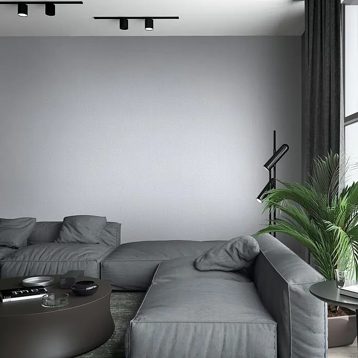 Vliestapete - Grau, Sonstiges, 10,05 x 0,53 m - Ein großes, graues Stoff-Ecksofa in einem modernen Wohnzimmer. Seine weichen Kissen laden zum Entspannen ein.