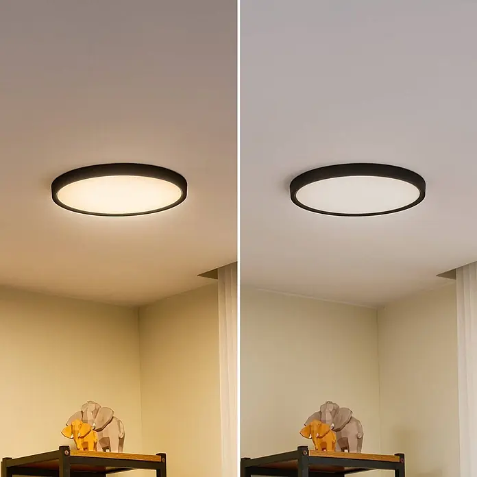 Lindby Deckenleuchte Pravin - schwarz - Runde schwarze Deckenleuchte, montiert, die warmweißes (links) und kaltweißes (rechts) Licht abgibt.