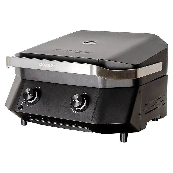 Cozze Plancha-Grill G 500 - Grillfläche (B x T): 53,5 x 41,8 cm, 5 kW, Schwarz - Dunkelgrauer Cozze Pizzaofen mit zwei Bedienknöpfen und silbernem Griff, zeigt das Markenlogo.