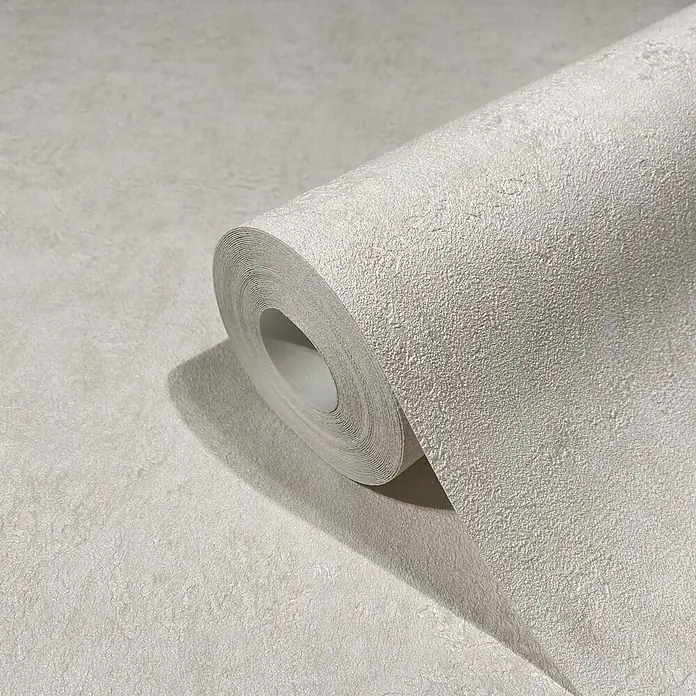 Marburg Kumano Vliestapete Struktur I - Beige, Sonstiges, 10,05 x 0,53 m - Rolle strukturierter Tapete in einer hellen, neutralen Farbe, teilweise abgerollt.