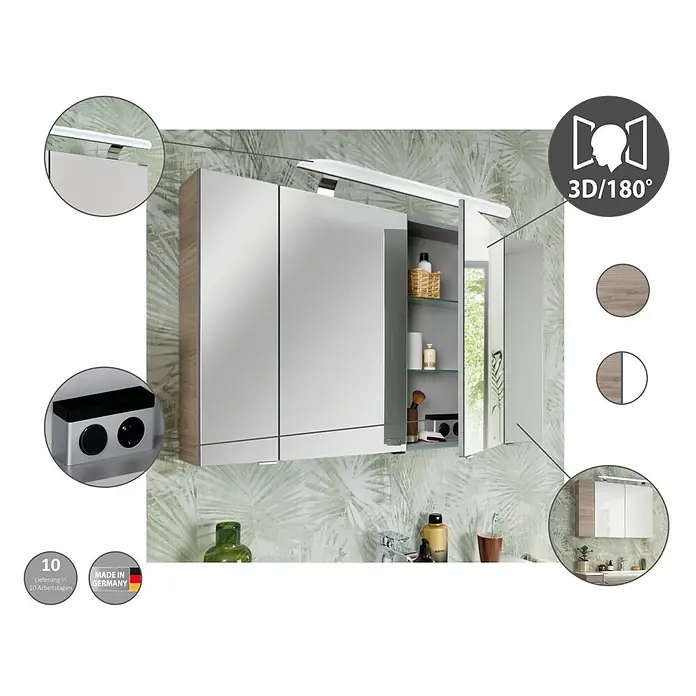 Fackelmann Luxor Spiegelschrank - B x H: 800 x 680 mm, Steinesche Holzoptik - Spiegelschrank mit Beleuchtung, Innenfächern und Steckdosen, Holzoptik-Seiten, über einem Waschbecken montiert.