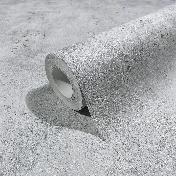 Marburg City Glow Vliestapete Uni - Steingrau, Uni, 10,05 x 0,53 m - Silber-graue strukturierte Tapetenrolle mit metallischem Beton-Effekt, teilweise abgerollt.