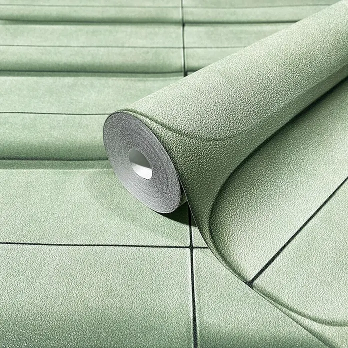 Marburg Shades Iconic Vliestapete Grafik III - Grün, Grafisch, 10,05 x 0,53 m - Teilweise abgerollte hellgrüne Struktur-Tapetenrolle mit schwarzem geometrischem Gittermuster.