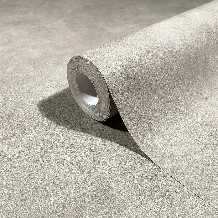 Marburg Whisper Vliestapete Putzoptik I - Beige, Sonstiges, 10,05 x 0,53 m - Hellgraue strukturierte Tapetenrolle, teilweise abgerollt, die ihre körnige, velourslederartige Oberfläche zeigt.