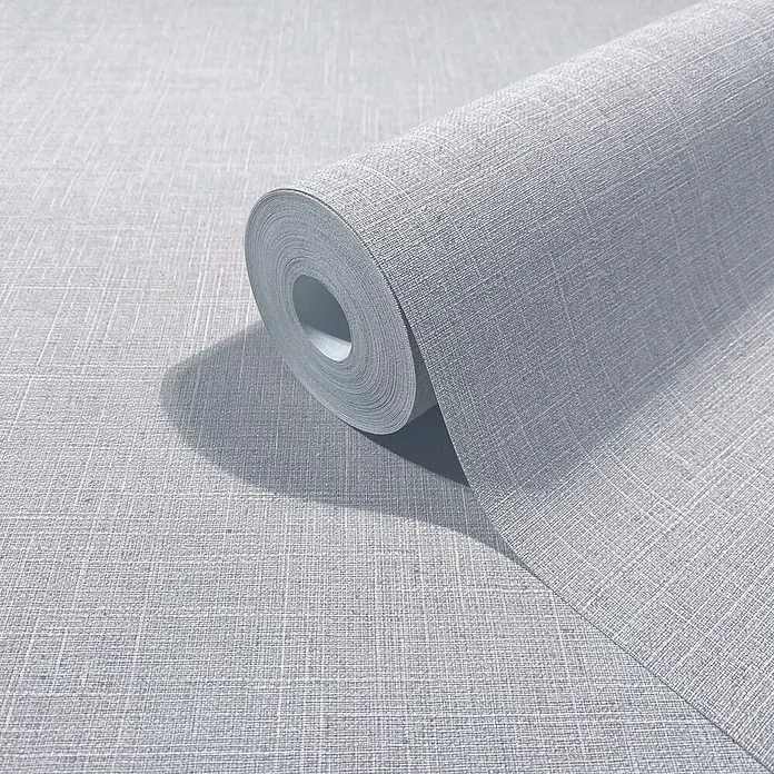 Marburg Boho Vliestapete Uni - Blau-Weiß, Uni, 10,05 x 0,53 m - Hellgraue Tapetenrolle mit feiner Leinenstruktur, teilweise ausgerollt.