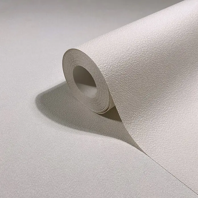 Marburg Vliestapete Novamur Oriana Uni - Creme, Uni, 10,05 x 0,53 m - Rolle hellbeiger, texturierter Tapete mit dezentem Noppenmuster, teilweise abgerollt.