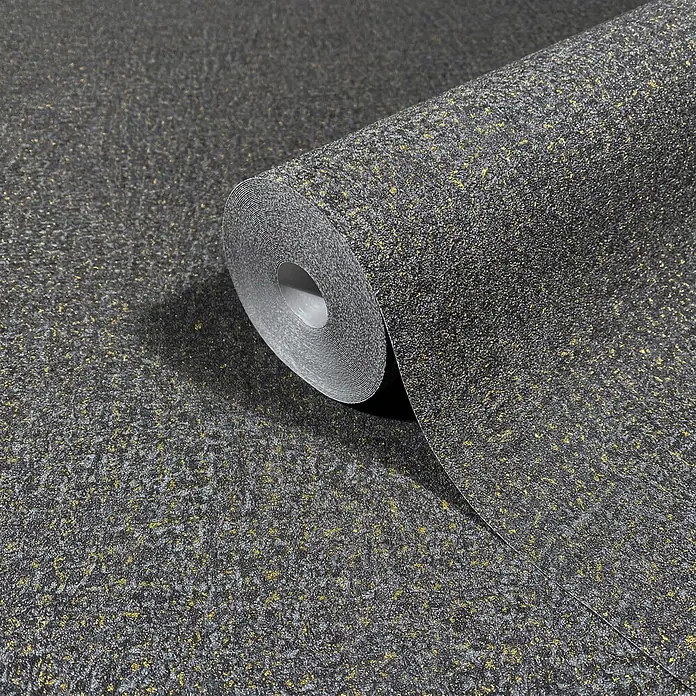 Marburg Ritus Vliestapete Putzoptik - Schwarz, Sonstiges, 10,05 x 0,53 m - Dunkelgraue strukturierte Tapete mit goldfarbenem Sprenkelmuster, teilweise abgerollt.