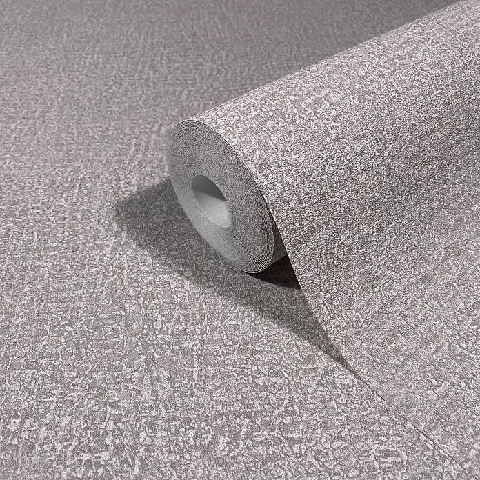Marburg Ritus Vliestapete Putzoptik - Grau-Braun, Sonstiges, 10,05 x 0,53 m - Graue, strukturierte Tapetenrolle mit subtilem Glitzereffekt, teilweise abgerollt, um das Muster zu zeigen.