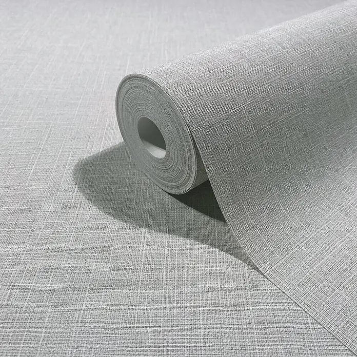Marburg Boho Vliestapete Uni I - Hellgrau, Uni, 10,05 x 0,53 m - Rolle hellgrauer Tapete mit Leinenstruktur, teilweise abgerollt.