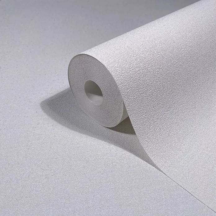 Marburg Ritus Vliestapete Putzoptik - Weiß, Sonstiges, 10,05 x 0,53 m - Texturierte weiße Tapetenrolle, teilweise ausgerollt, zeigt ihre körnige Oberfläche und das geschichtete Innere.