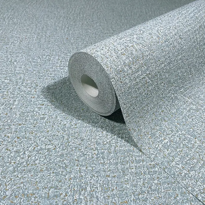 Marburg Ritus Vliestapete Putzoptik - Blau, Sonstiges, 10,05 x 0,53 m - Eine Rolle hellblauer strukturierter Tapete mit goldenen Sprenkeln, teilweise abgerollt, um ihr Muster zu zeigen.