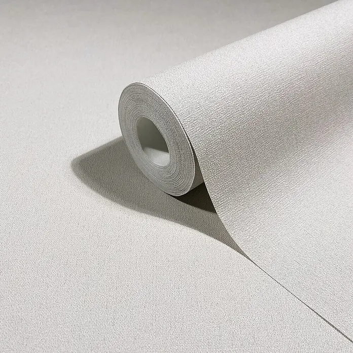 Marburg Whisper Vliestapete Uni - Hellgrau, Uni, 10,05 x 0,53 m - Rolle hellgrauer Tapete mit feiner Leinenstruktur, teilweise abgerollt.