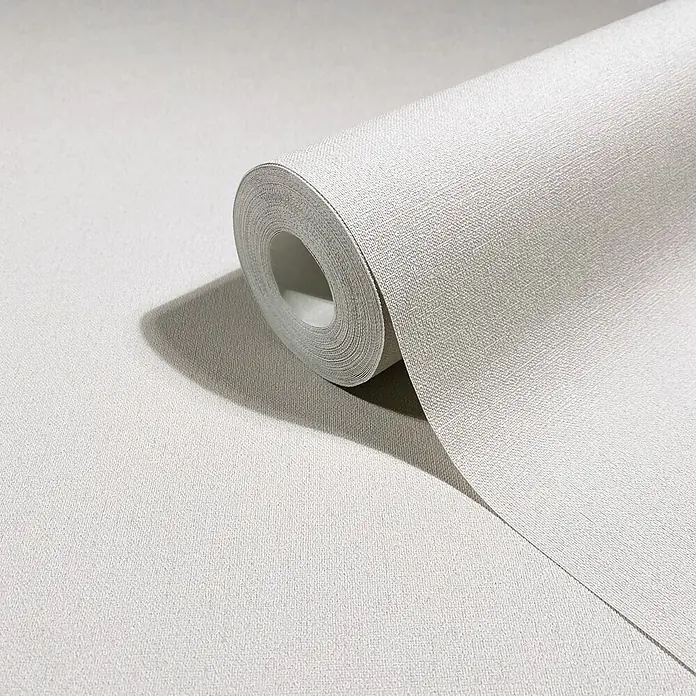 Marburg Whisper Vliestapete Uni - Weiß-Beige, Uni, 10,05 x 0,53 m - Hellgraue strukturierte Tapetenrolle, teilweise ausgerollt.