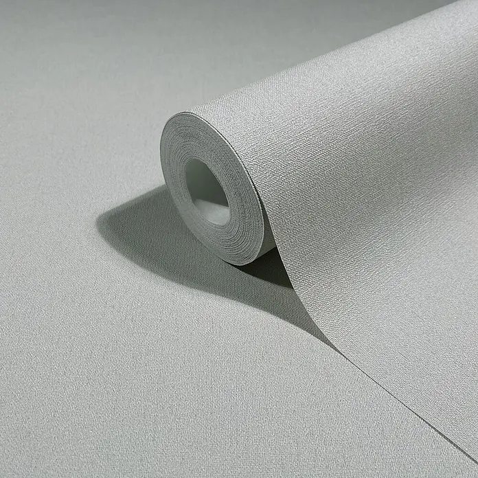 Marburg Whisper Vliestapete Uni - Greige, Uni, 10,05 x 0,53 m - Hellgraue Tapetenrolle mit dezenter Textilstruktur, teilweise abgerollt.
