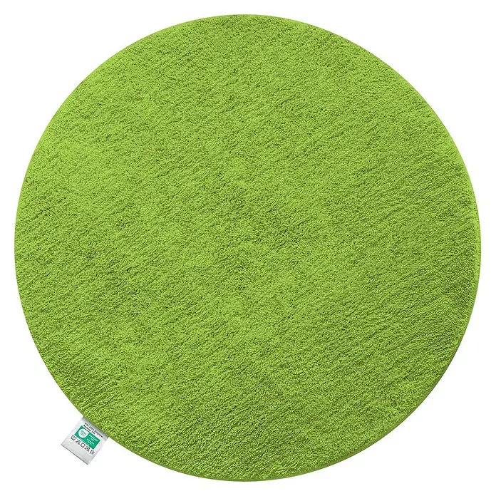Floordirekt Badteppich Sky - 95 x 95 cm, Apfelgrün, 100% Polyester - Runde grüne Badematte mit flauschiger Textur und einem kleinen weißen Etikett.
