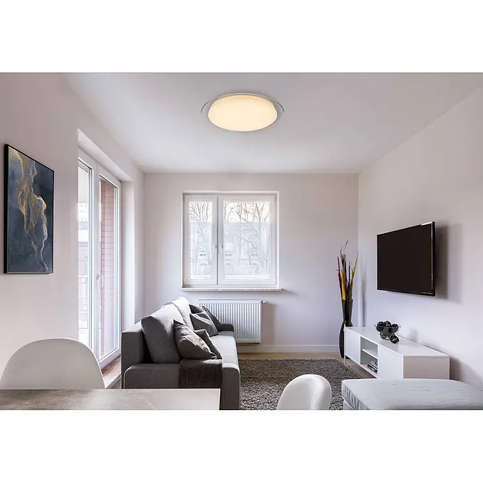 Globo LED-Deckenleuchte rund Optima - 30 W, Ø x H: 46 x 8,5 cm, Weiß, Klar, Warmweiß - Runde weiße LED-Deckenleuchte mit Sternen-Diffusor und klarem Außenring, erhellt ein modernes Wohnzimmer.