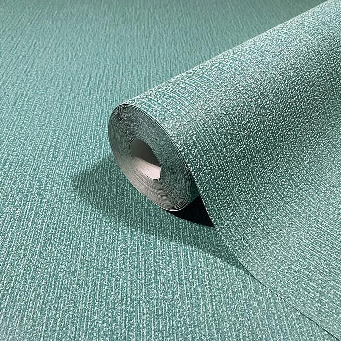 Marburg Vliestapete Novamur Mona Uni I - Grün, Uni, 10,05 x 0,53 m - Türkise strukturierte Tapetenrolle, teilweise abgerollt, um ihre genoppte Oberfläche zu zeigen.