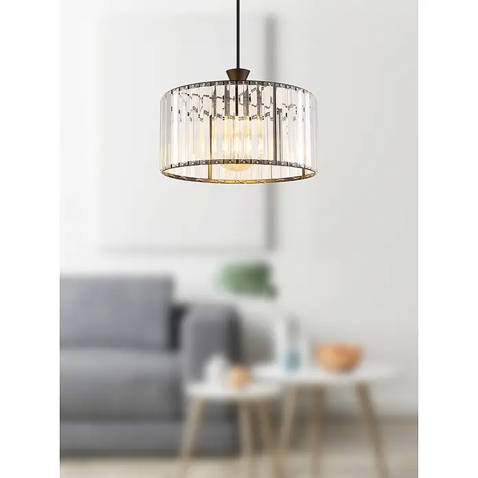 Globo Pendelleuchte Jordana - 60 W, E27, Pendellänge: 1.200 mm - Zylindrische Kristall-Pendelleuchte mit dunklem Rahmen und warmen Glühbirnen, die in einem modernen Wohnzimmer hängt.
