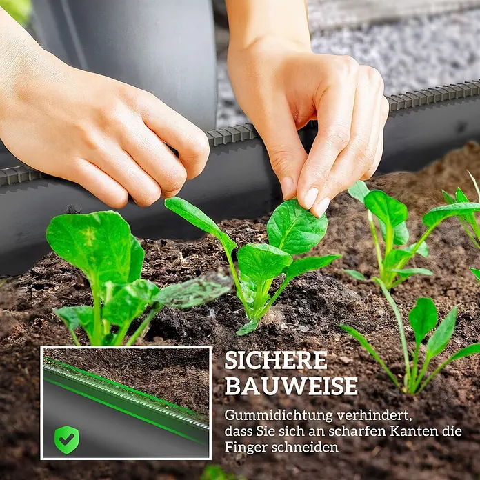 Furnicato Hochbeet - 150 x 62 x 30 cm, Stahl, Dunkelgrau - Schwarze Gartenbegrenzung mit Gummidichtung, die ein Beet abgrenzt, während Hände Sämlinge pflanzen und Sicherheit betonen.