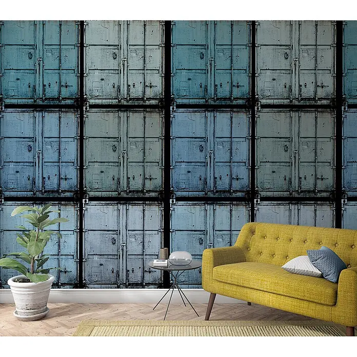Marburg Smart Art Easy Fototapete Illustration - B x H: 159 mm x 270 cm, Vlies, Blau - Industrieller Tapetenstil mit gestapelten blau-grauen Seecontainern, als Akzentwand in modernem Wohnzimmer mit gelbem Sofa.