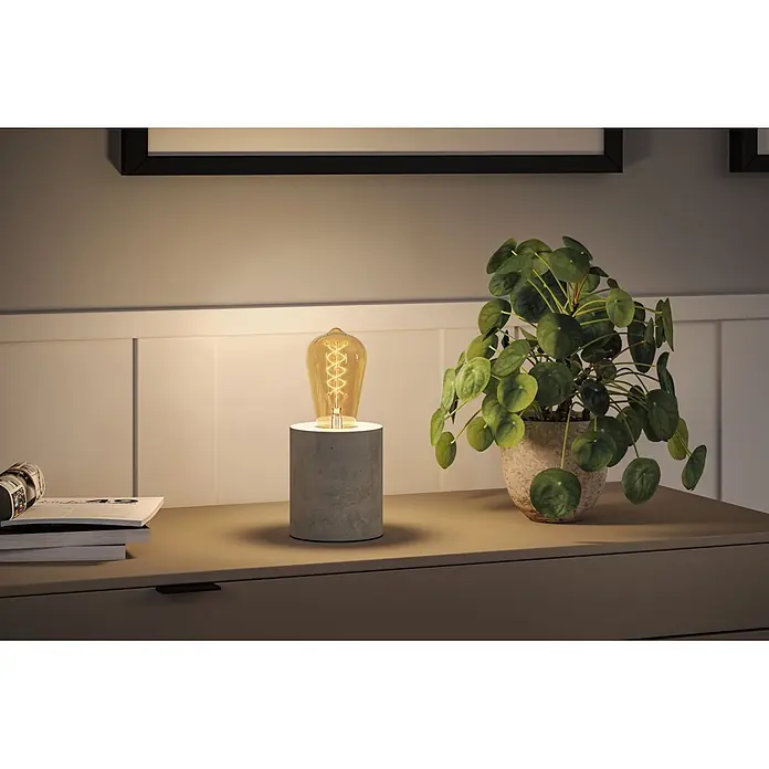 Paulmann LED-Lampe S-Form ST64 - E27, Dimmbar, Warmweiß, 300 lm, 4,2 W - Beton-Tischleuchte mit Edison-Glühbirne, warmes Licht auf Kommode.