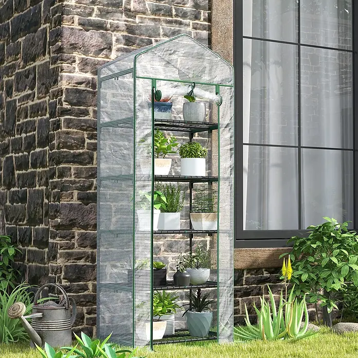 Furnicato Gewächshaus - Außenmaß inkl. Dachüberstand (B x T): 49 x 69 cm, Material Seitenwand: Kunststoff, 14 mm, weiß - Hohes Gewächshaus mit transparenter Gitterabdeckung und grünem Rahmen, gefüllt mit Topfpflanzen, im Freien platziert.