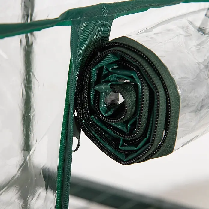 Outsunny Gewächshaus - 69 x 49 cm, Material Seitenwand: Kunststoff, 0,3 mm, Grün - Gerollte dunkelgrüne Reißverschlussbahn und transparente Plastikabdeckung, wahrscheinlich für ein Gewächshaus.