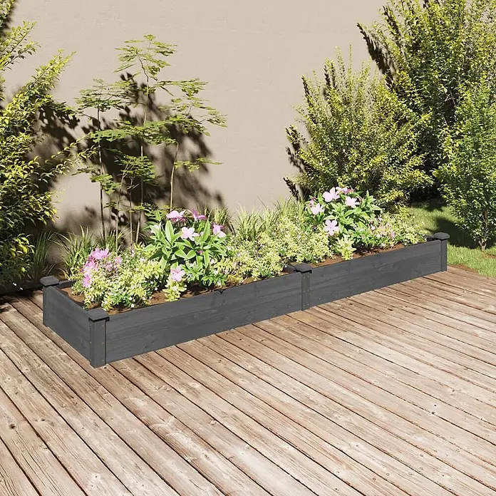 Furnicato Hochbeet - 240 x 60 x 25 cm, Holz, Grau - Langes, dunkelgraues Hochbeet aus Holz, bepflanzt mit bunten Blumen und Pflanzen auf einer Holzterrasse.