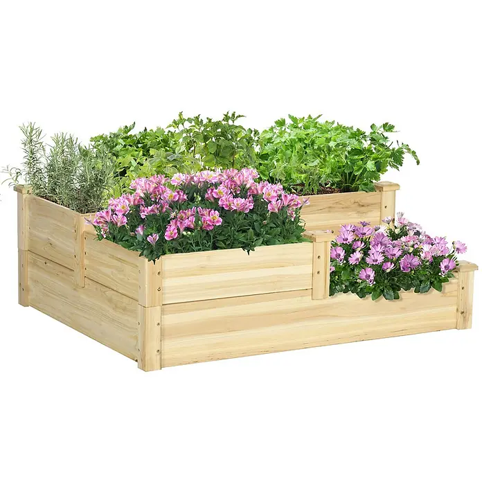 Furnicato Hochbeet - 108 x 88 x 36 cm, Holz, Natur - Gestuftes Hochbeet aus hellem Holz mit Kräutern und rosa Blumen.