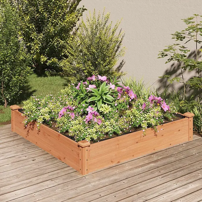 Furnicato Hochbeet - 120 x 120 x 25 cm, Holz, Braun - Hölzernes L-förmiges Hochbeet mit bunten Blumen, auf einer Holzterrasse in einem Garten platziert.