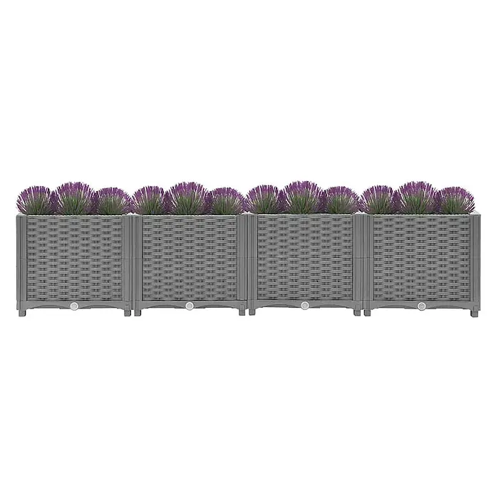 Furnicato Hochbeet - 160 x 40 x 38 cm, Kunststoff, Hellgrau - Graue, modulare Pflanzgefäße in Rattan-Optik mit lila Pflanzen.