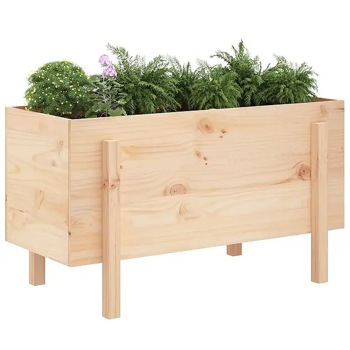 Furnicato Hochbeet - 50 x 101 x 57 cm, Holz, Natürliche Kiefer - Helles Holz-Hochbeet auf Beinen, bepflanzt mit verschiedenen grünen Pflanzen und bunten Blumen.