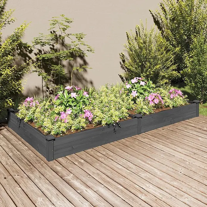 Furnicato Hochbeet - 120 x 240 x 25 cm, Holz, Grau - Dunkelgraues L-förmiges Hochbeet aus Holz mit Pflanzen auf einer Terrasse.