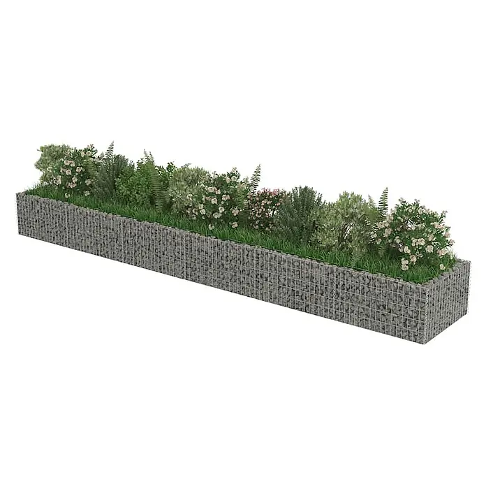 Furnicato Hochbeet - 90 x 540 x 50 cm, Stahl, Silber - Langer, rechteckiger Gabionen-Pflanzkasten mit grauen Steinen, grünen Pflanzen und hellrosa Blüten.