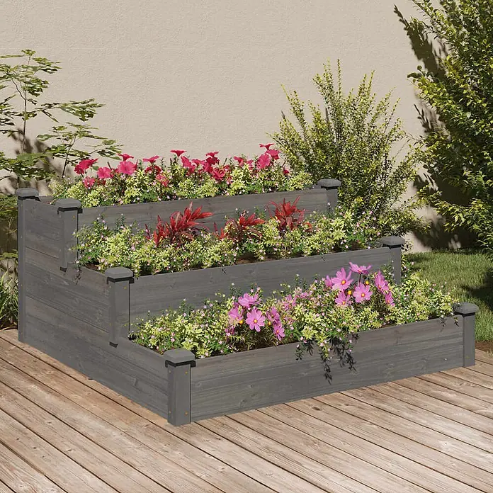 Furnicato Hochbeet Tannen-Massivholz - 120 x 120 x 56 cm, Holz, Grau - Grau lasiertes dreistufiges Hochbeet aus Holz, gefüllt mit bunten Blumen und Pflanzen, auf einer Holzterrasse.