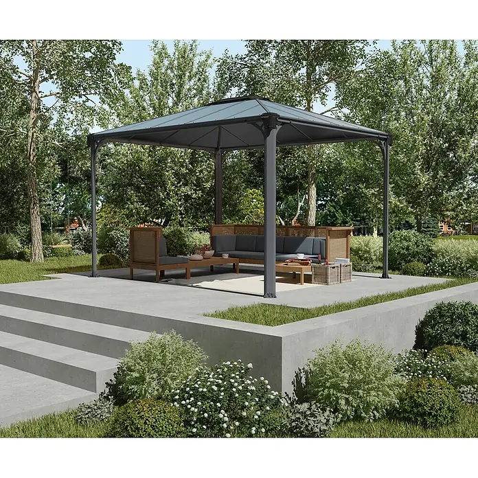 Palram – Canopia Standard-Pavillon Martinique 3600 - B x T: 295 x 360 cm, Farbe Gestell: Anthrazit, Aluminium - Dunkelgrauer Metall-Pavillon mit transparentem Dach, der eine moderne Sitzgruppe auf einer Terrasse im Garten schützt.