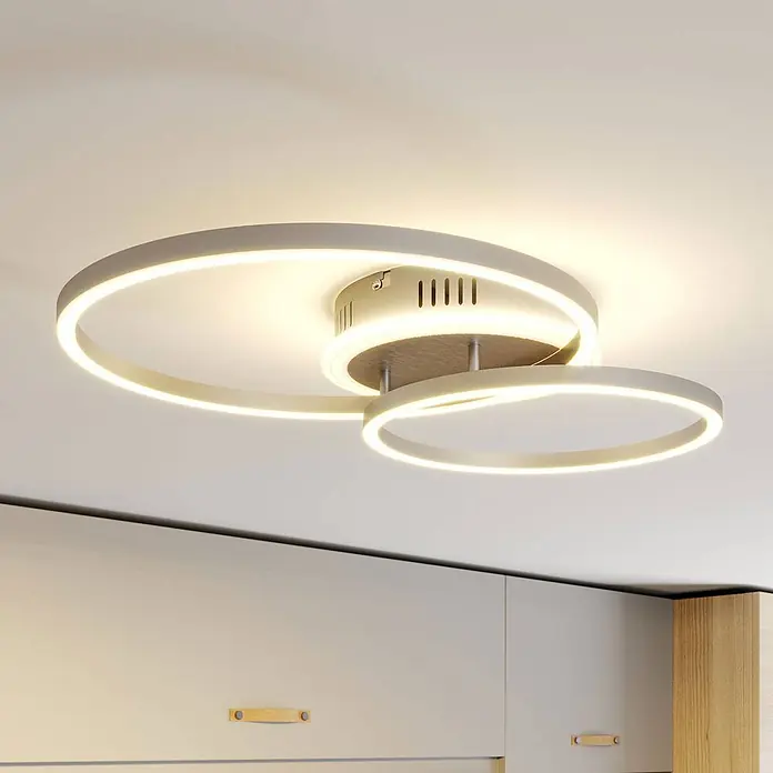 Lindby Deckenleuchte Edica - alu / grau / zink, alu / grau / zink - Moderne LED-Deckenleuchte mit zwei ineinandergreifenden Ringen aus grauem Metall, leuchtet einen Raum aus.