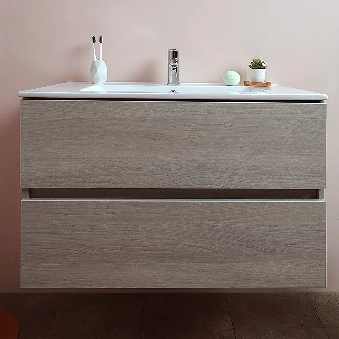Kiamami Valentina Badmöbel-Set - Helles Holz - Wandhängender Badezimmerschrank aus hellem Holz mit weißem Waschbecken und zwei Schubladen.
