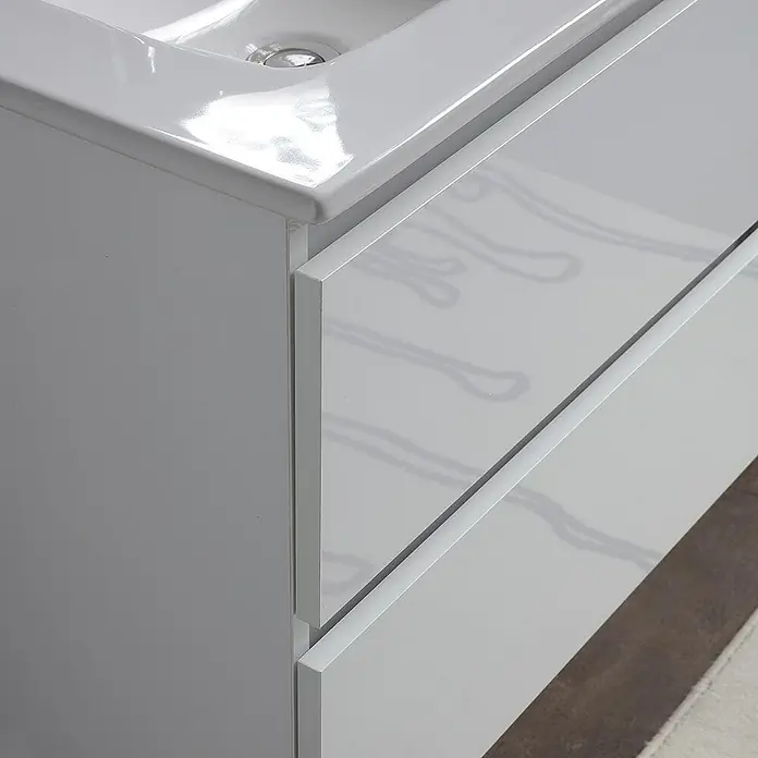 Kiamami Valentina Badmöbel-Set - Weiß - Weißer Badezimmerschrank mit integriertem Keramikwaschbecken und zwei glänzenden Schubladen mit Griffmulden.