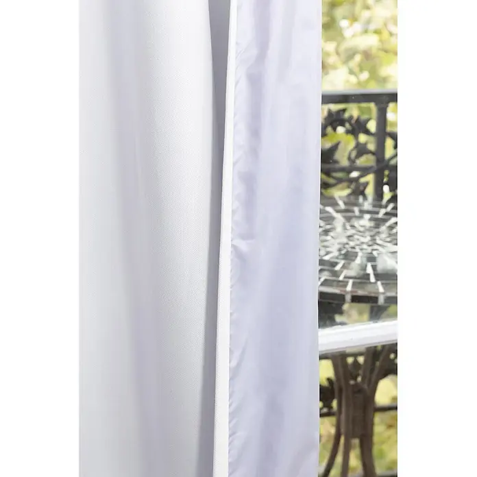 Cortina térmica Cocoon - An x Al: 140 x 260 cm, 100% poliéster, Blanco - Cortina blanca de textura sutil, parcialmente abierta en una ventana.
