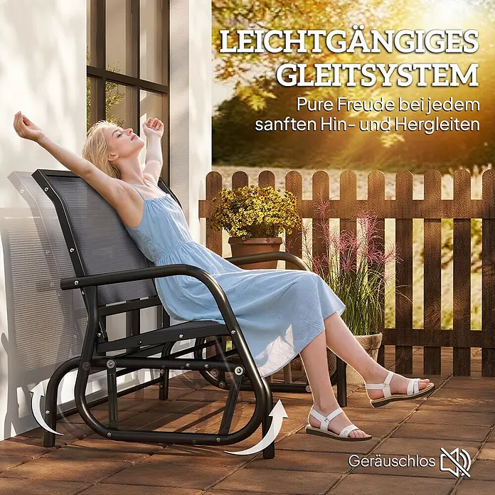 Furnicato Gartenbank Texteline - B x T x H: 70 x 120 x 85 cm, Metall, Texteline-Gewebe, Grau - Frau entspannt sich auf einem dunkelgrauen Outdoor-Gleitsessel mit sanftem, leisem Schiebesystem auf einer Terrasse.
