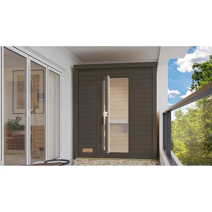 Karibu Saunahaus Hytti - Ohne Ofen, Terragrau, L x B x H: 113 x 196 x 228 cm - Dunkelbraune Holzsauna mit Glastür auf einem Balkon.
