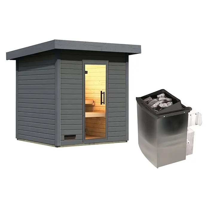 Karibu Saunahaus Kaapi 3 - 9 KW Ofen mit interner Steuerung, Terragrau, L x B x H: 196 x 196 x 228 cm - Graue Holzsaunakabine mit Glastür und Bänken, daneben ein Saunaofen aus Edelstahl mit Steinen.